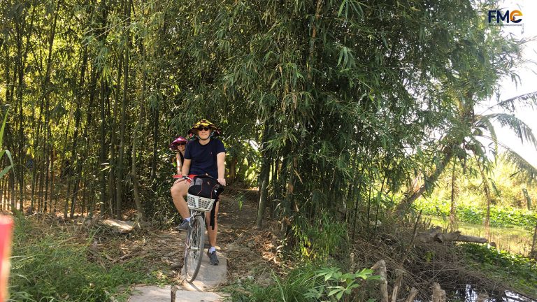 Tourist do bicycle tour in Mekong Delta
