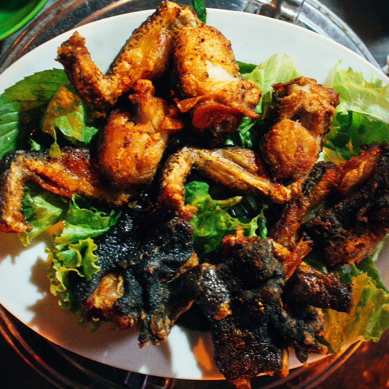 Deep fried tiger frogs with skin on