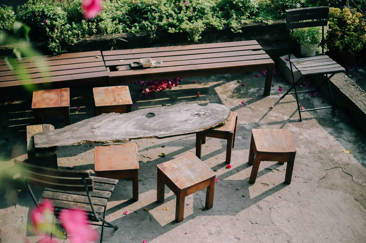 Wooden tables and chairs of the cafe