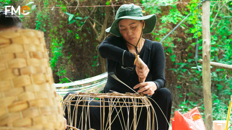 Woman doing traditional handicraft in Xeo Quyt historical site, Dong Thap full day tour