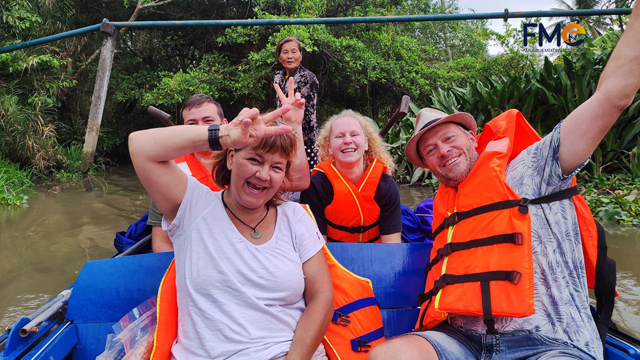 Tourists having a great time on their Mekong Delta Cai Rang floating market tour