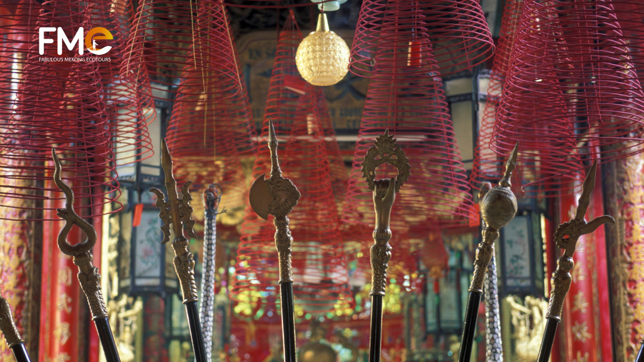 Chinese miniature weapons on a rack in Ong temple