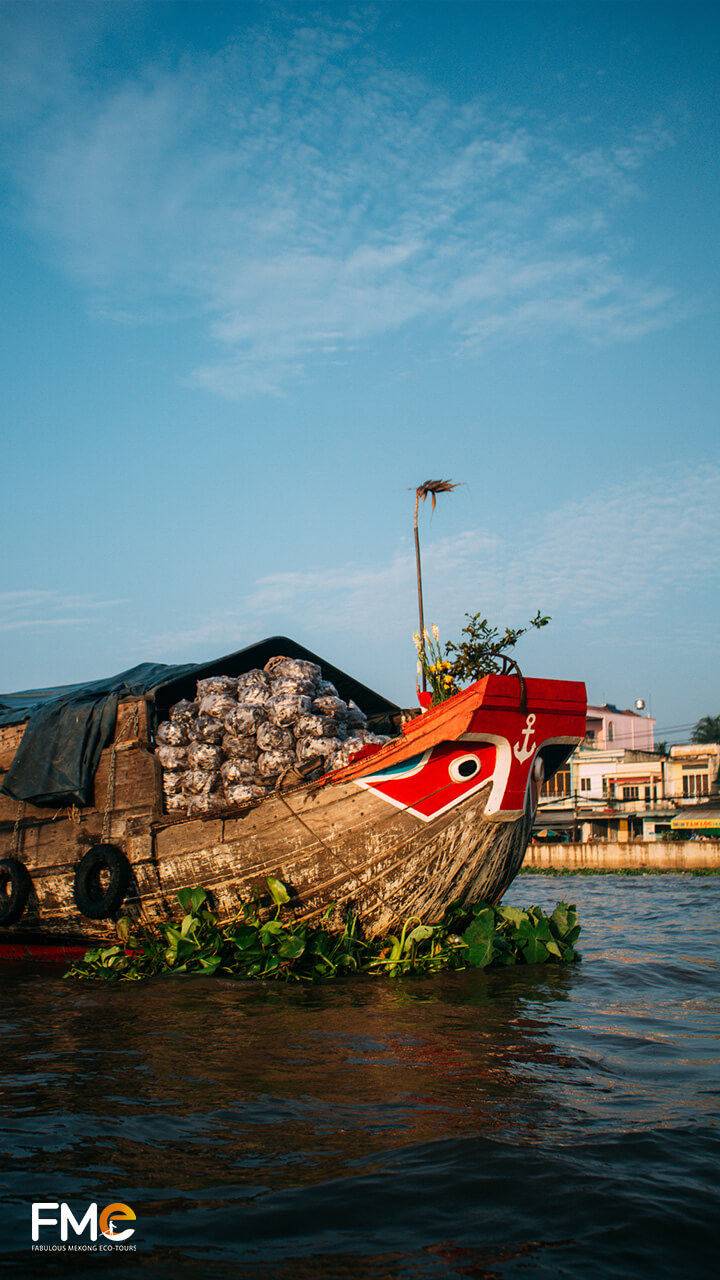 A traditional Vietnamese boat moving on the river