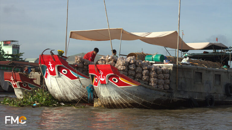 Boats carrying agricultural products anchor at Vietnam's floating market