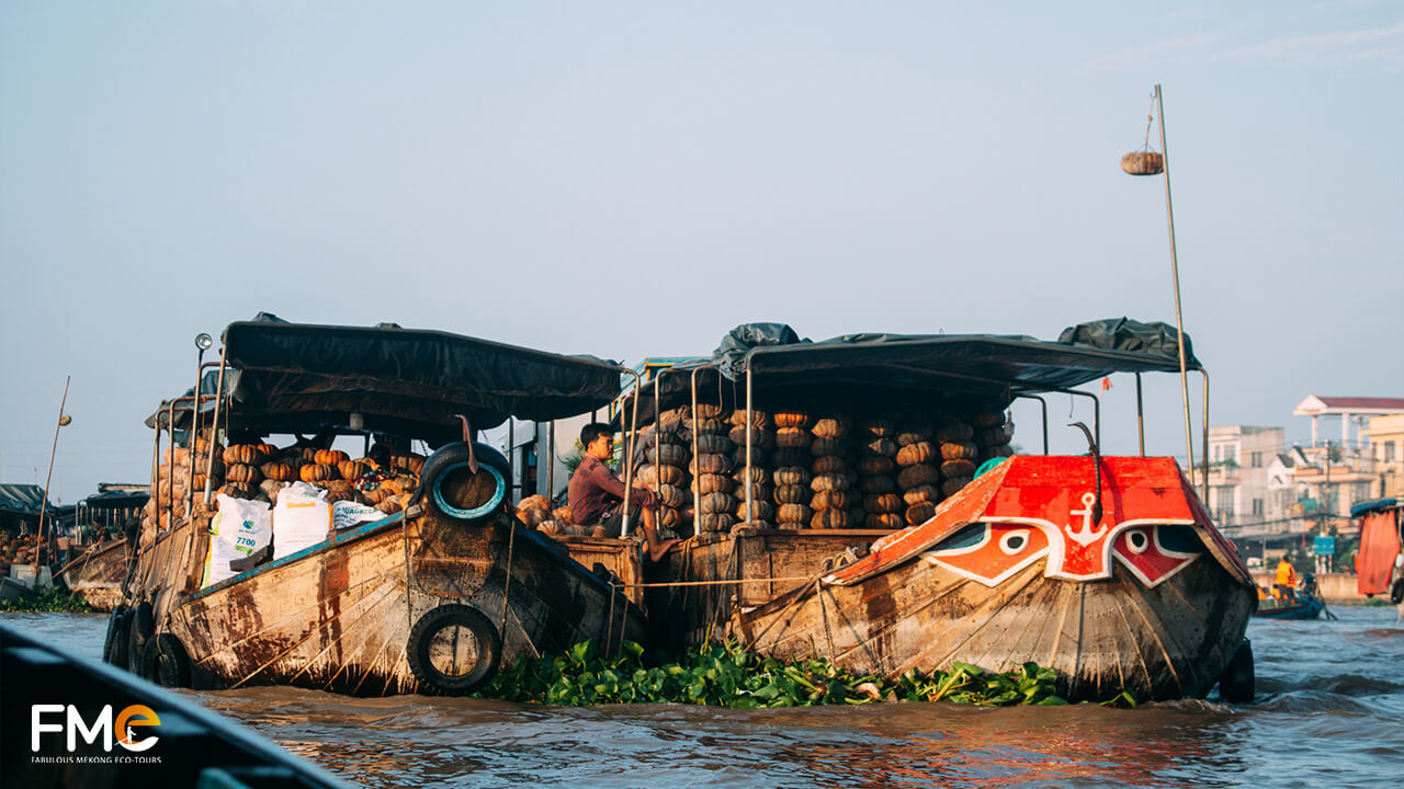 Boats carrying pumpkins anchored at Can Tho floating market