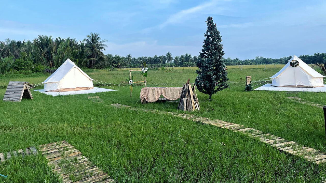 Green space between rice fields at CLassique Farm Tra Vinh Campground