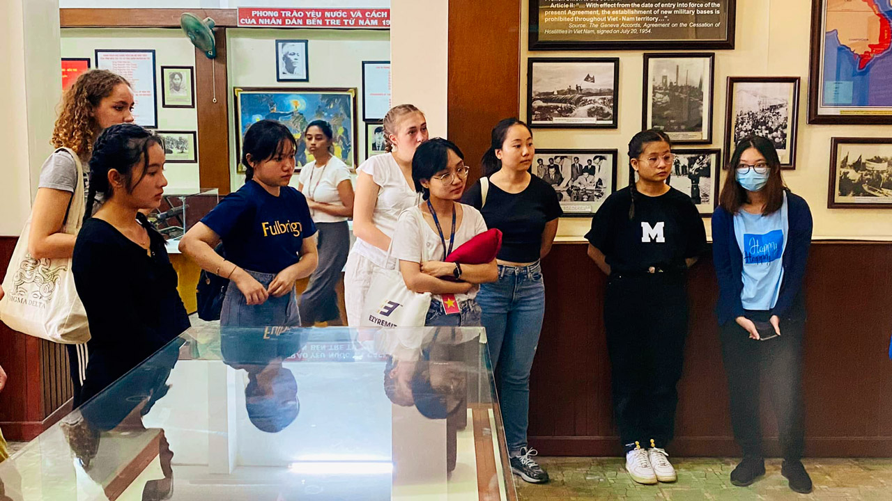 Tourists listen to stories about the Vietnam War at Ben Tre Museum