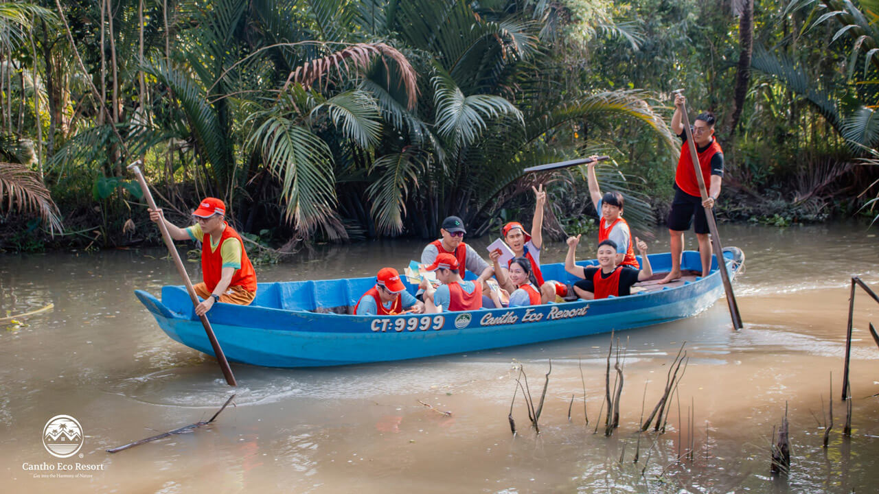 Rowing a boat to explore the river scene at Can Tho Eco Resort