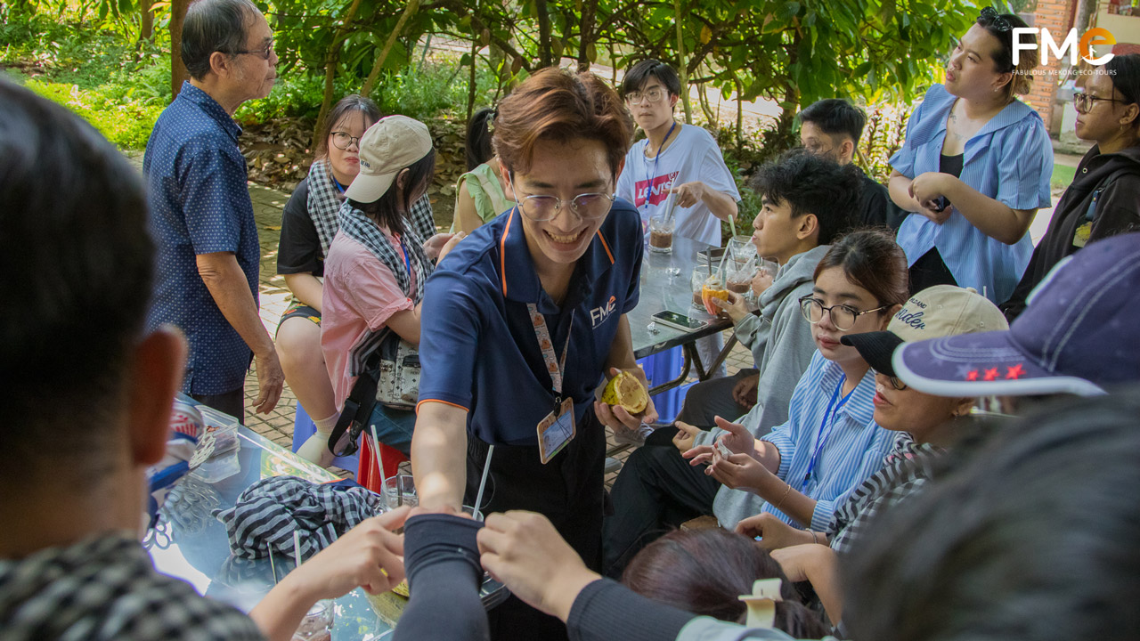 Alumni and students engage in cultural exchange at the cacao garden