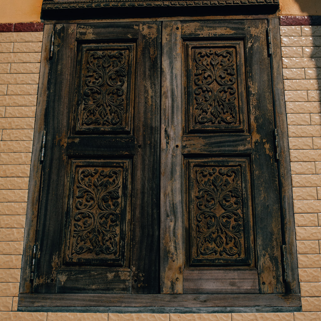 Khmer patterns of Angkor culture carved on wooden doors at Ta Pa Pagoda