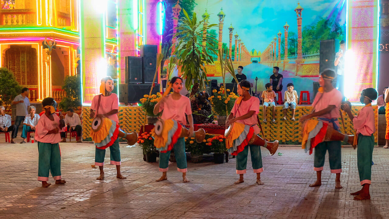 Traditional dance performance during a celebration at a Vietnamese Buddhist temple