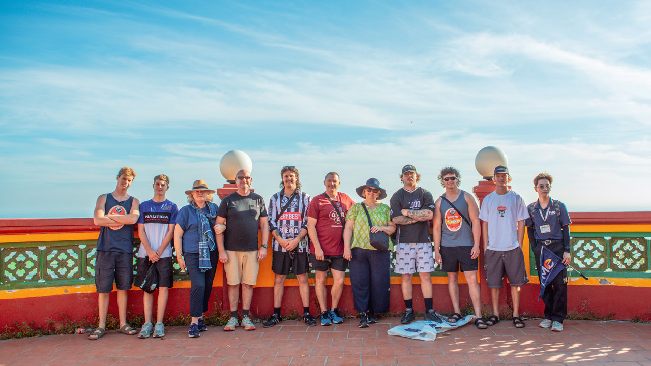 A happy traveler family discovering the Mekong.